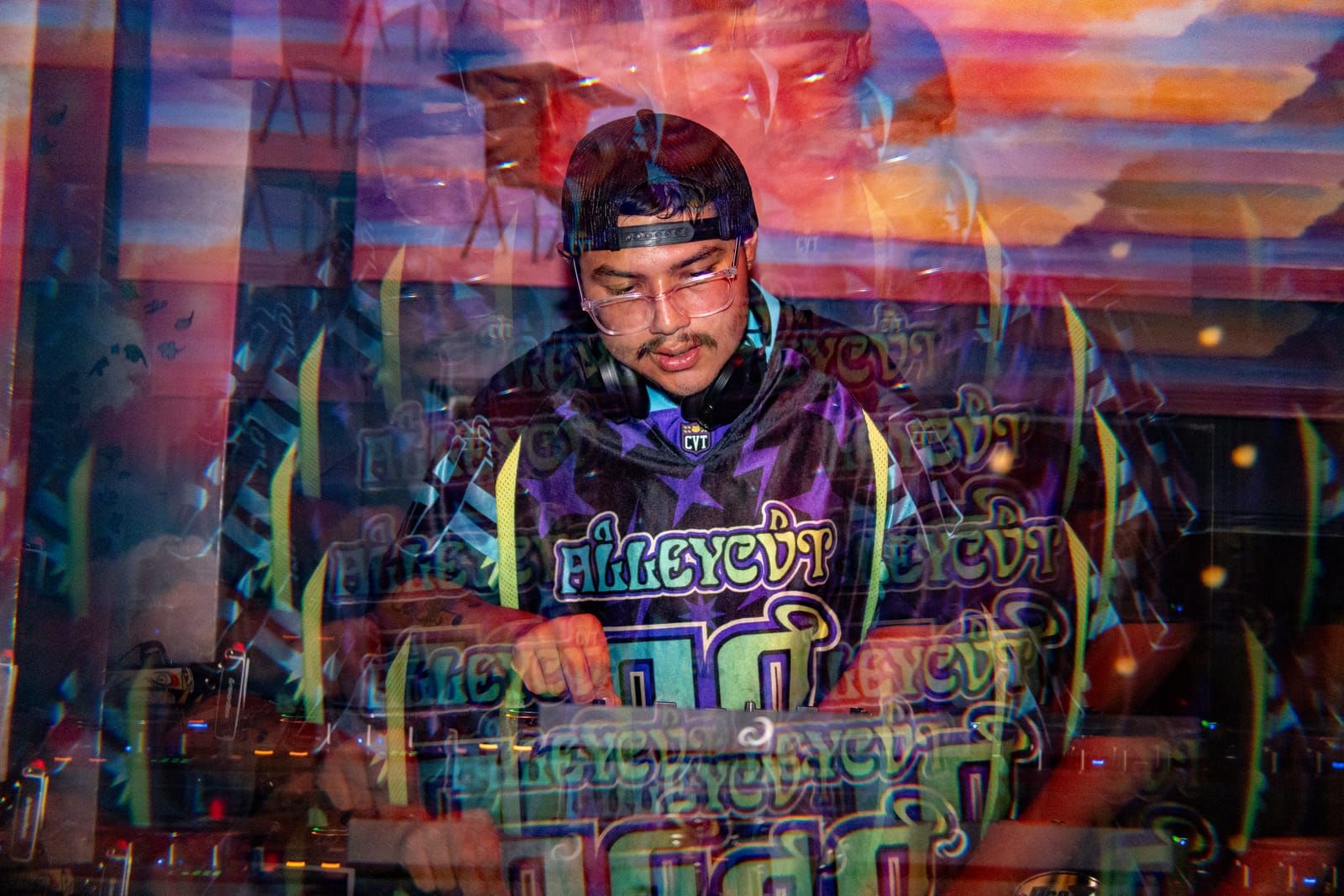 Dill the Menace lit in color behind the controller during his set