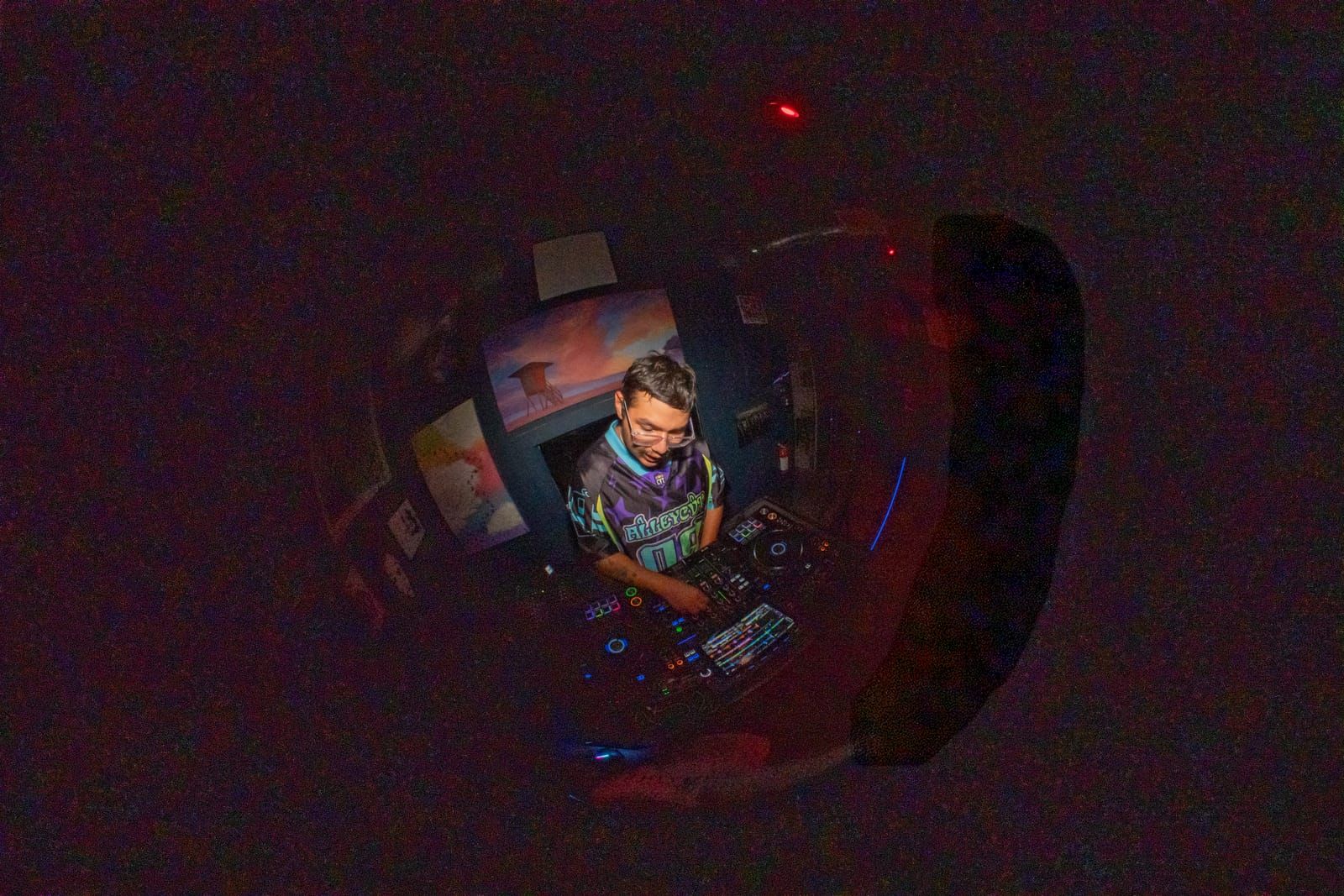 Blurred long-exposure shot of Dill the Menace behind the decks