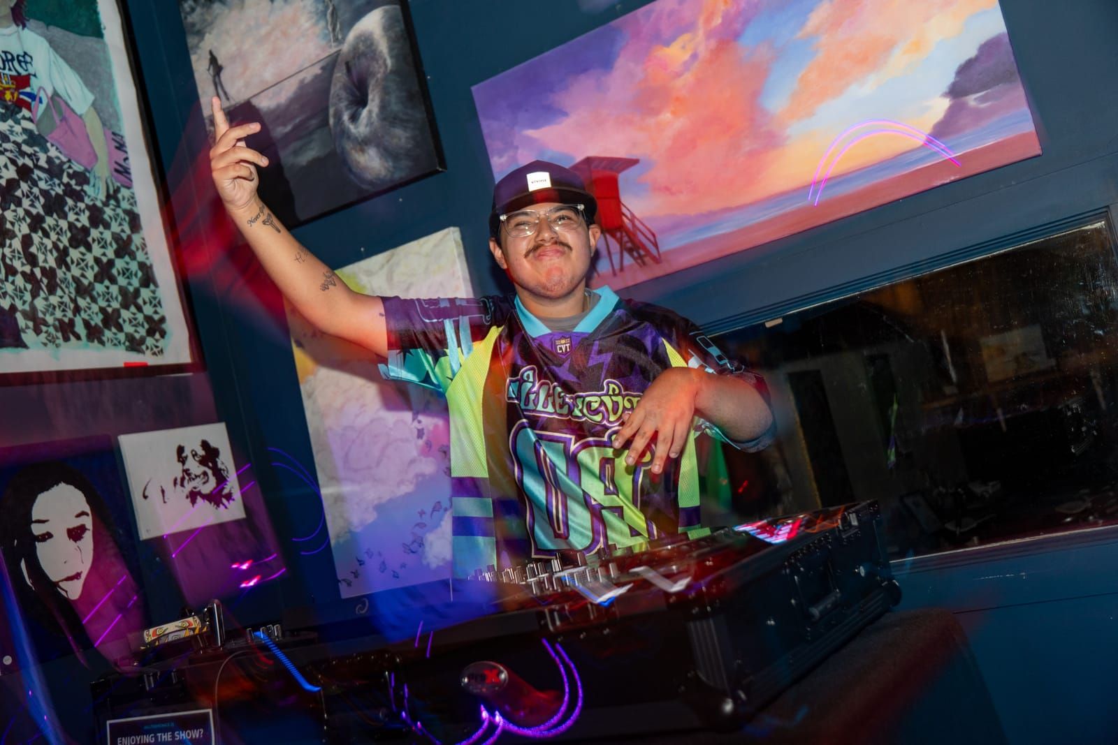 Dill the Menace raising a hand to the crowd mid-set