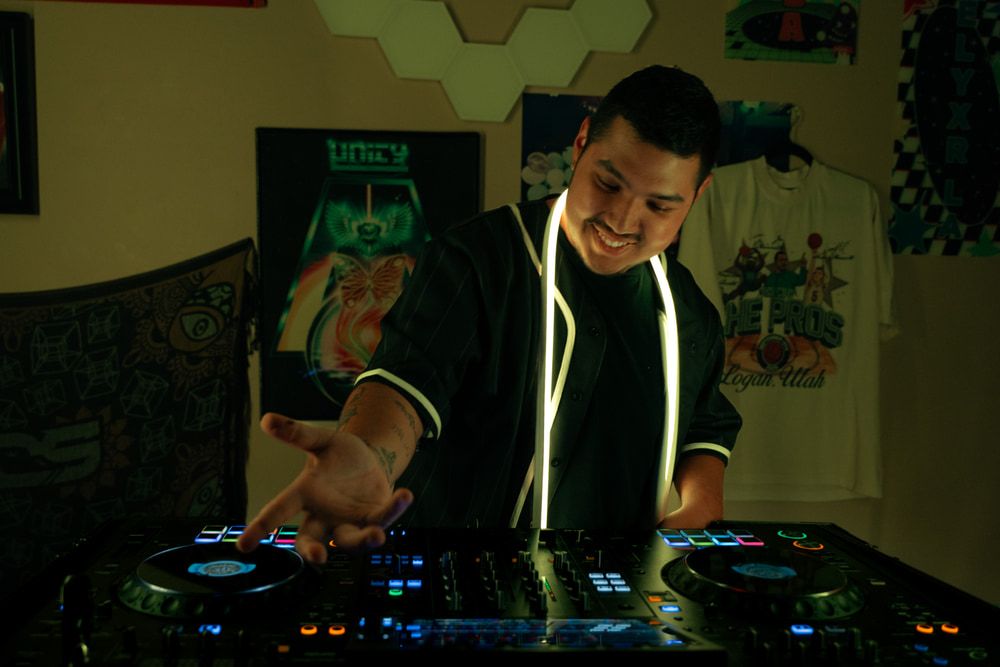 Dill the Menace at the decks with warm amber lighting